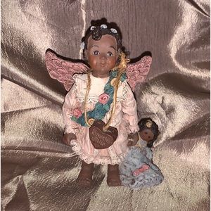 Sarah’s Attic Vintage figurine (MAY ADORA) Angle holding babydoll, # 221,  1992
